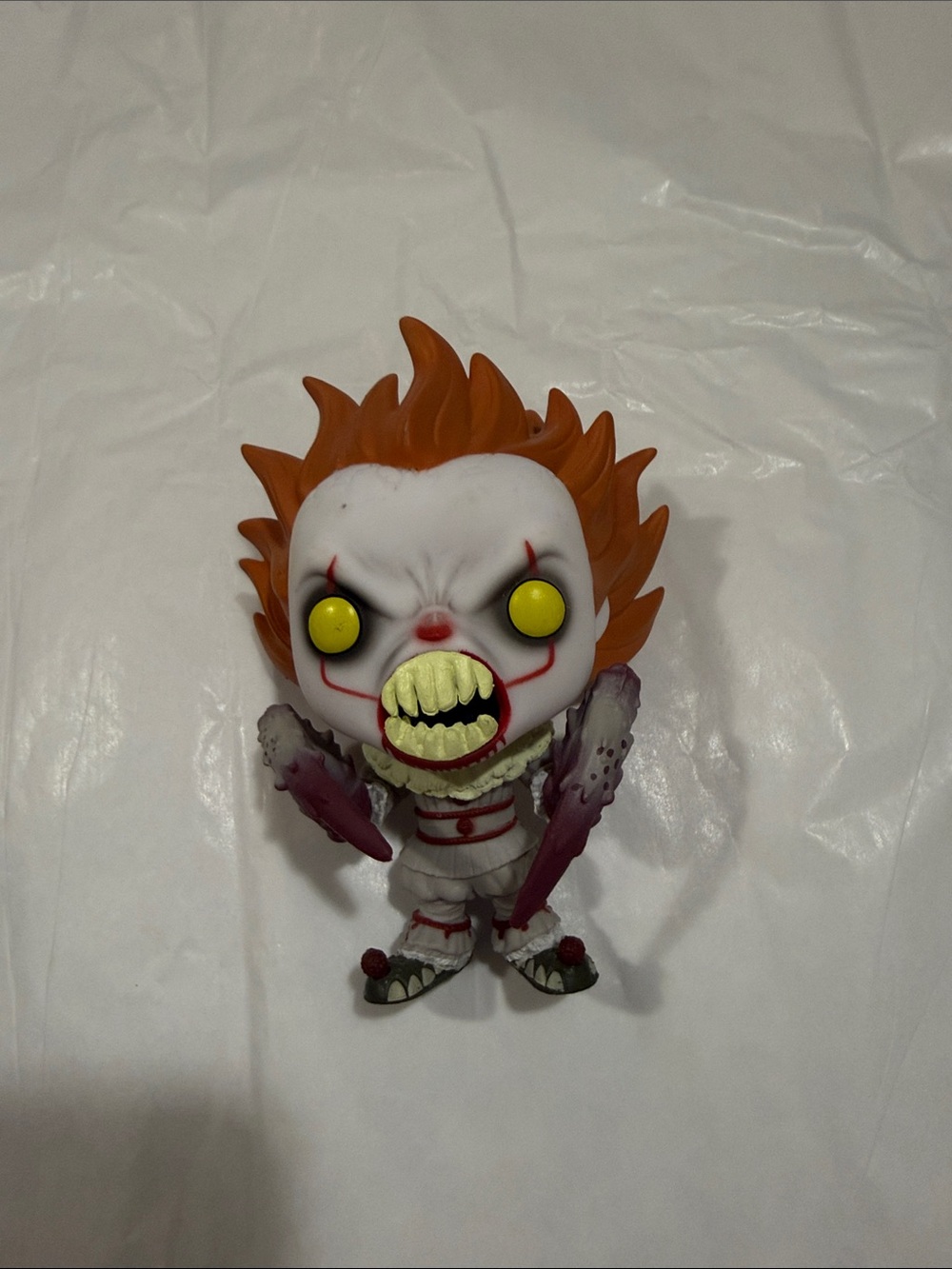 Funko Clown Figure with Orange Hair and Yellow Eyes